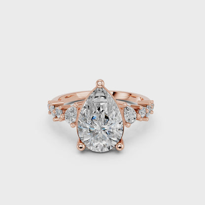 PEAR ENGAGEMENT RING WITH SIDE STONE  3.00 CTTW