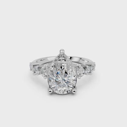 PEAR ENGAGEMENT RING WITH SIDE STONE  3.00 CTTW